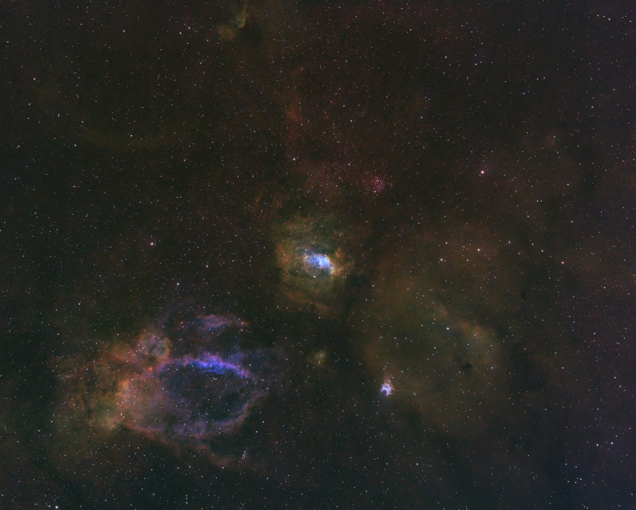 deep space astrophoto of the lobster and bubble nebulae